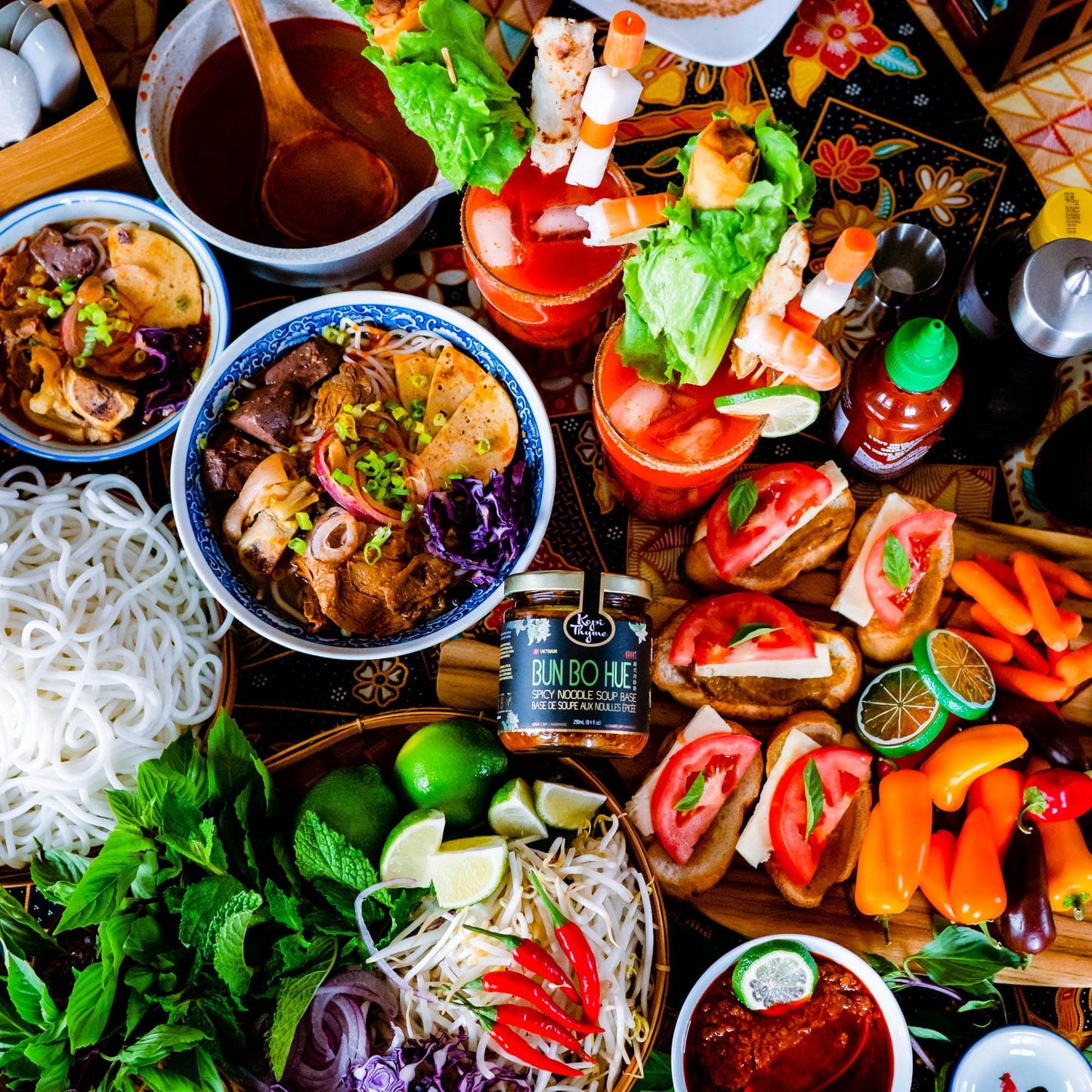 easy recipes with bun bo hue, dip vegetables, caeser drink, traditional bowl with Kopi thyme's version of this fun vietnamese dish.
